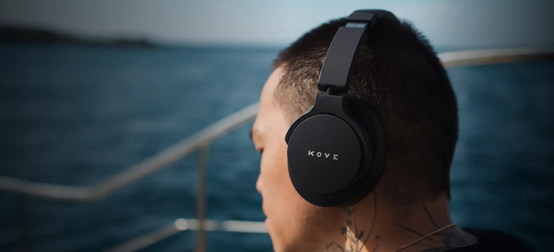 Man on boat wearing headphones