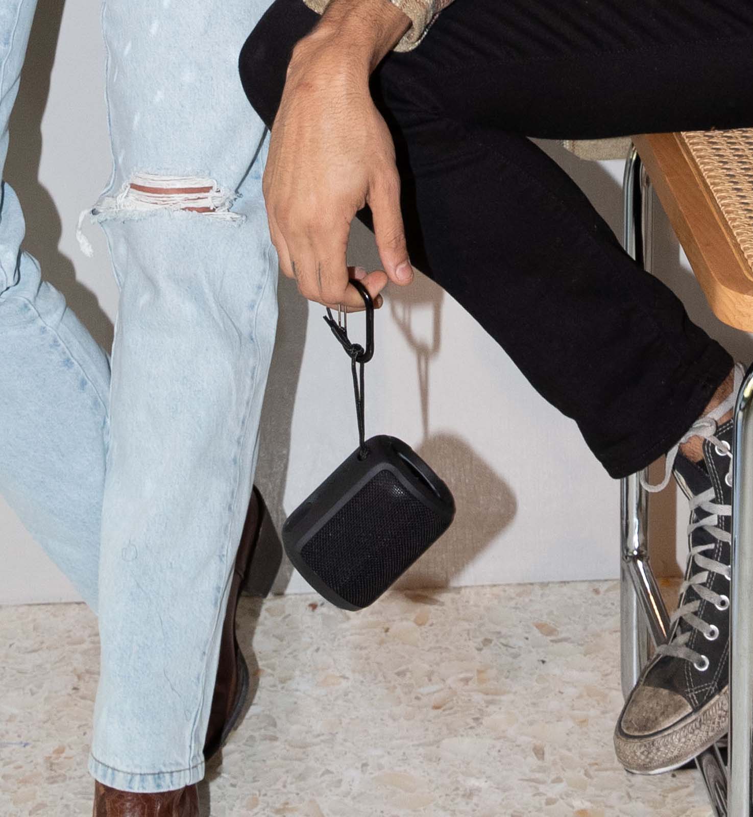 Mini Kommuter hanging from it's strap and carabiner 