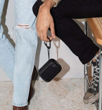 Mini Kommuter hanging from it's strap and carabiner 